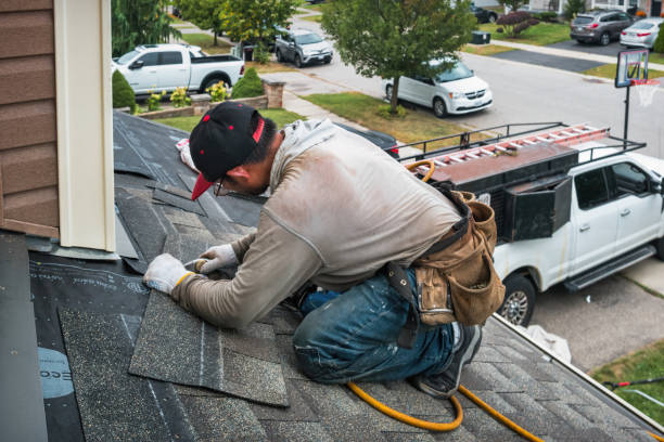Professional Emergency Roof Repair technician working in Bedford, MA
